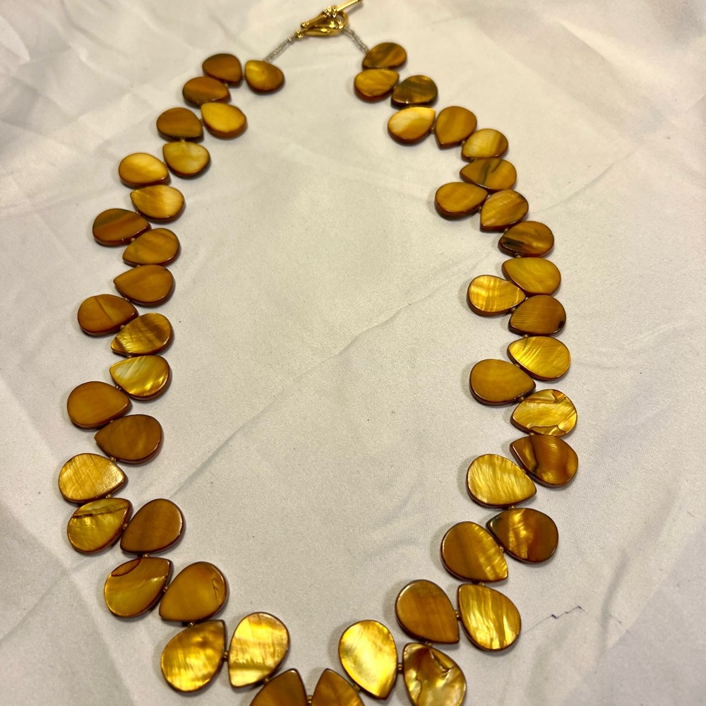 Amber colored Mother of Pearls necklace with gold tone toggle.